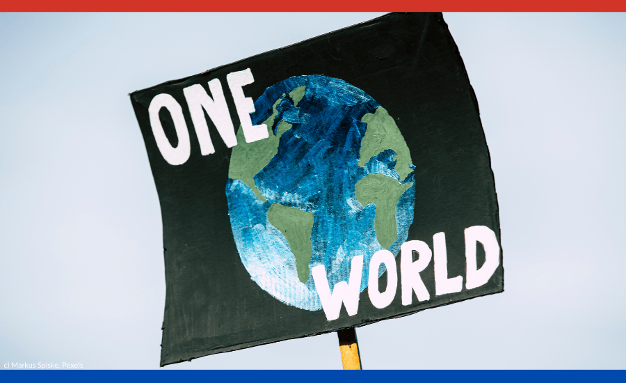 Das Bild zeigt ein Schild mit der Aufschrift: one world.